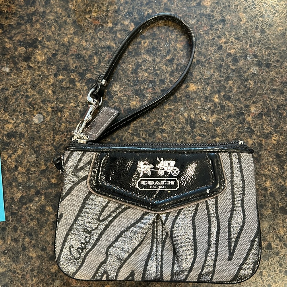 Coach animal print wristlet..like new. NEVER USED